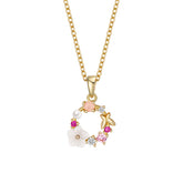Gold-plated necklace featuring pink flower pendants adorned with crystals, showcasing elegance and charm.